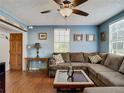 Relaxing living room with sectional sofa and wood floors at 610 S Laurel Ave, Sanford, FL 32771