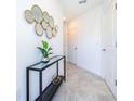 Bright entryway with contemporary mirror and console table at 951 Splash Shot Pl # 0, Davenport, FL 33896