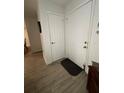 Bright entryway with tile flooring and built-in storage at 5587 Devonbriar Way # 105, Orlando, FL 32822