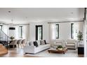 Open living room with neutral color palette and hardwood floors at 33 S Graham Ave, Orlando, FL 32803