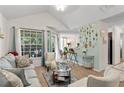 Open concept living room and kitchen with light walls at 1069 S Hiawassee Rd # 1336, Orlando, FL 32835