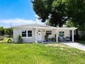 Quaint house with stone exterior, covered porch, and landscaping at 240 People St, Maitland, FL 32751