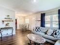 Open living and dining space with hardwood floors and ample natural light at 240 People St, Maitland, FL 32751