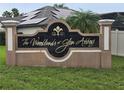 Community entrance sign for The Woodlands at Glen Abbey at 531 Soft Shadow Ln, Debary, FL 32713
