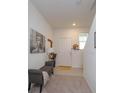 Welcoming entryway with seating area and access to other rooms at 190 Mandovi St, Davenport, FL 33837