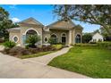 Exterior of charming two-story home with landscaping at 1560 Eagle Nest Cir, Winter Springs, FL 32708