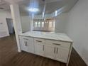 Modern kitchen featuring white cabinets, quartz countertops, and stainless steel appliances at 111 Lake Dot Dr, Sanford, FL 32773