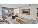 Bright and airy living room with a dining area and modern decor at 4721 Clock Tower Dr # 108, Kissimmee, FL 34746