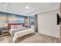 Spacious main bedroom with mountain mural and en-suite bathroom at 4721 Clock Tower Dr # 108, Kissimmee, FL 34746
