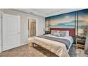 Large main bedroom with mountain mural and en-suite bathroom at 4721 Clock Tower Dr # 108, Kissimmee, FL 34746