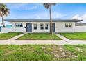 Newly renovated duplex, featuring a clean, modern aesthetic and well-maintained lawn at 701 N Grandview Ave, Daytona Beach, FL 32118