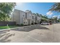 Gray townhome with parking and green landscaping at 4447 Brook Hollow Cir, Winter Springs, FL 32708