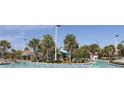 Community pool with a waterslide and lush landscaping at 8975 Azalea Sands Ln, Davenport, FL 33896