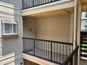 Exterior view of condo building with balcony at 1932 Lake Atriums Cir # 70, Orlando, FL 32839