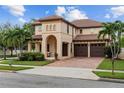 Two story house with brick driveway and landscaping at 11823 Otterbrooke Trl, Windermere, FL 34786