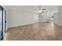 Bright living room features tile floors and an open floor plan at 112 Winterglen Dr, Sanford, FL 32771