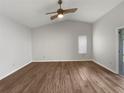 Spacious living room with wood flooring and lots of natural light at 112 Winterglen Dr, Sanford, FL 32771