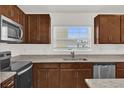 Modern kitchen with stainless steel appliances and granite countertops at 607 Alder Ln, Auburndale, FL 33823