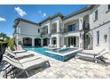 Resort-style pool with plenty of seating and a spa at 925 Desert Mountain Ct, Reunion, FL 34747