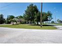 House on a corner lot with a large yard and street view at 1109 S Indiana Ave, Groveland, FL 34736
