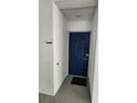 Private apartment entrance with blue door and welcome mat at 3161 Paradox Cir # 202, Kissimmee, FL 34746