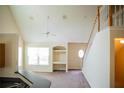 Open living room with high ceilings and staircase at 3478 Westchester Square Blvd # 202, Orlando, FL 32835