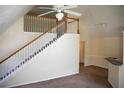 Bright living room with staircase and high ceilings at 3478 Westchester Square Blvd # 202, Orlando, FL 32835