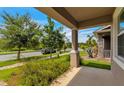Covered porch with view of the street and neighborhood at 8217 De Haven Street, Orlando, FL 32832
