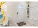 Bright entryway with built-in shelving and keyless entry at 2428 Dubai St, Kissimmee, FL 34747