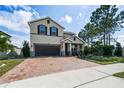 Two-story house with a two-car garage at 5200 Landmark Dr, St Cloud, FL 34771