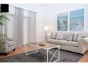Living room with contemporary furnishings and large TV at 703 Lucaya Loop # 1103, Davenport, FL 33897