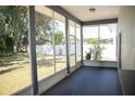 Relaxing screened porch overlooking a fenced backyard at 573 Hummingbird Ct, Kissimmee, FL 34759