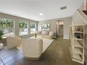 Bright living room with tiled floors, neutral walls, and ample natural light at 15106 Ovation Dr, Winter Garden, FL 34787