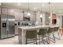 Modern kitchen with stainless steel appliances and an island at 4424 Kaipo Rd, Davenport, FL 33897