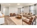Living room featuring a neutral color palette and comfortable seating at 4424 Kaipo Rd, Davenport, FL 33897