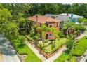 Stunning aerial view of a charming home with lush landscaping at 503 N Summerlin Ave, Orlando, FL 32803