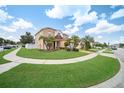Two story house with curb appeal and manicured lawn at 11932 Old Glory Dr, Orlando, FL 32837