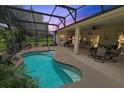 Inviting pool area with a covered patio and comfortable seating at 4423 Nottoway Dr, Leesburg, FL 34748