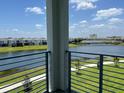 Lake view with bridge and community at 3141 Paradox Cir # 306, Kissimmee, FL 34746