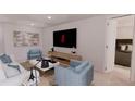 Modern living room with stylish furniture and large TV at 2985 Sw 173Rd Place Rd, Ocala, FL 34473