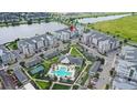 Apartment complex with pool, tennis court, and parking at 7573 Laureate Blvd # 1301, Orlando, FL 32827