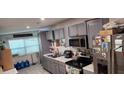 Grey kitchen with stainless steel appliances at 812 Lily Ct, Deltona, FL 32725