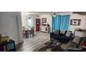 Living room with dining area and comfy sofa at 812 Lily Ct, Deltona, FL 32725