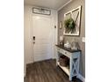 Front entry with console table and decor at 1908 Piedmont Ct, Mascotte, FL 34753