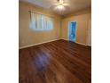 Spacious bedroom with wood-look flooring and access to a private bathroom at 1611 Sand Key Cir, Oviedo, FL 32765