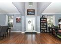 Two-story foyer with hardwood floors and built-in shelving at 319 Morning View Dr, Winter Garden, FL 34787