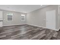 Open living area with hardwood floors and neutral wall colors at 1402 Persimmon Ave, Sanford, FL 32771