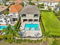 Luxury home with private pool and lush landscaping at 415 Muirfield Loop, Reunion, FL 34747