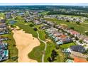 Community overview showing upscale homes and golf course at 415 Muirfield Loop, Reunion, FL 34747