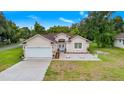 Beautiful one-story home with a large yard and a two-car garage at 17279 Peggy Ave, Mount Dora, FL 32757